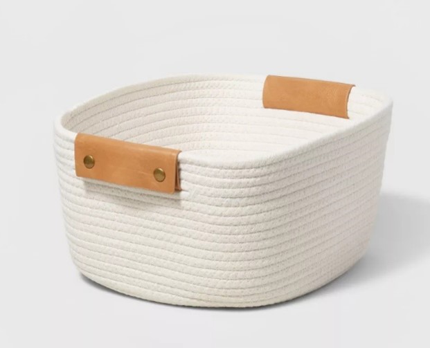 White cotton rope storage basket with tan handles