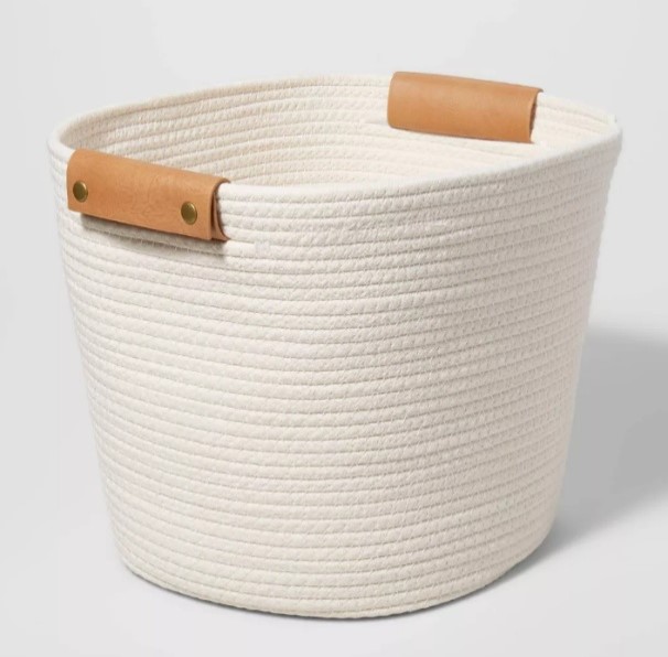 Tall white cotton rope storage basket with tan handles