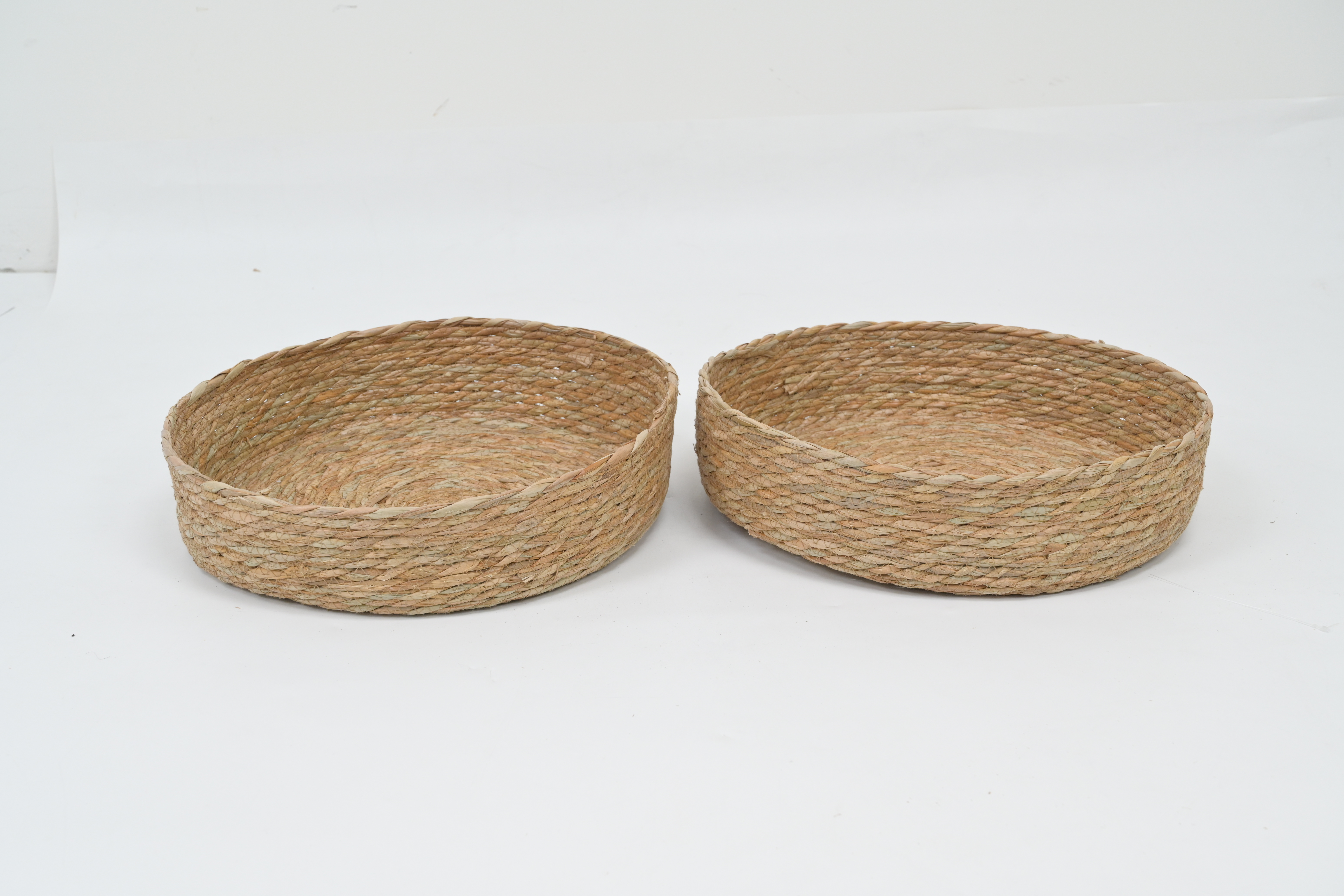 Set of natural woven tray baskets